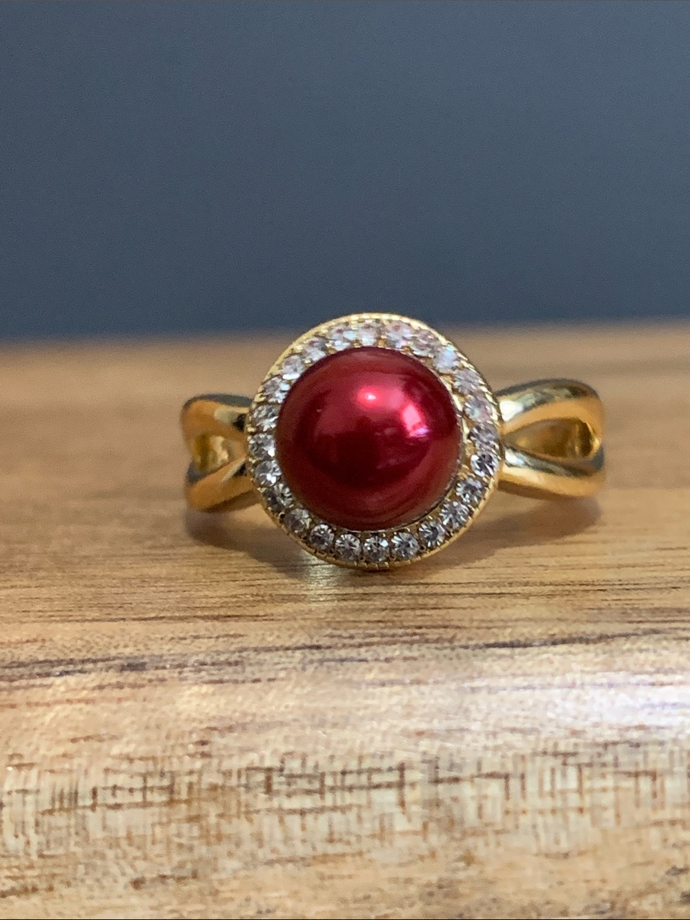 Gold tone dark red faux pearl ring size 6